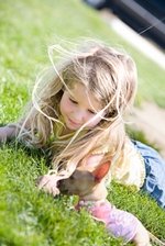 Child walking Chihuahua