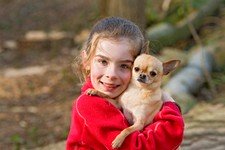 Child Holding Puppy